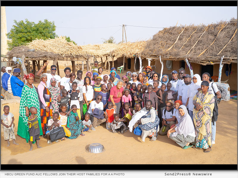 HBCU Green Fund AUC Fellows join their host families for a a photo during their trip to Northern Senegal